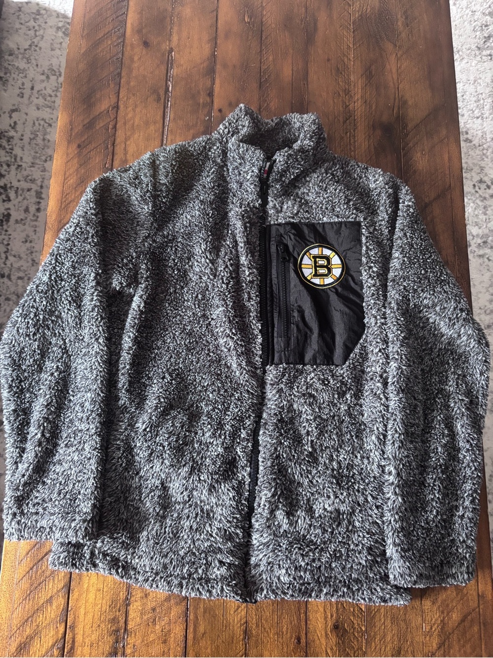 NHL Bruins girls zip up sweatshirt. Size medium(10-12).